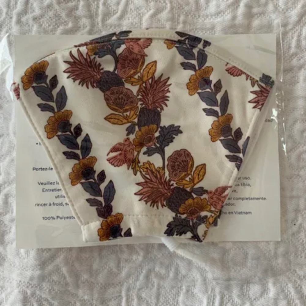 Brand new. Women’s Tory Burch Orange and White Logo Mask